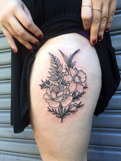 Daffodil flower and rose tattoo on the thigh for women