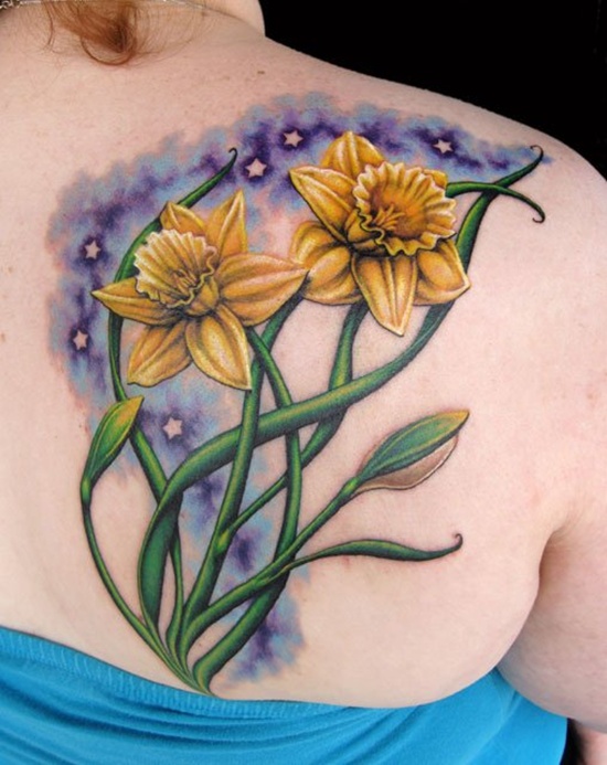 Large daffodil flower tattoo on the shoulder blade for women