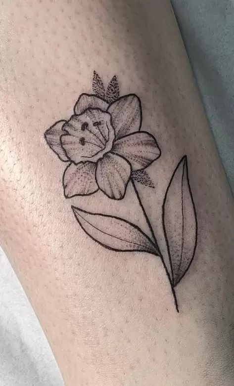 Daffodil flower tattoo on the leg for men