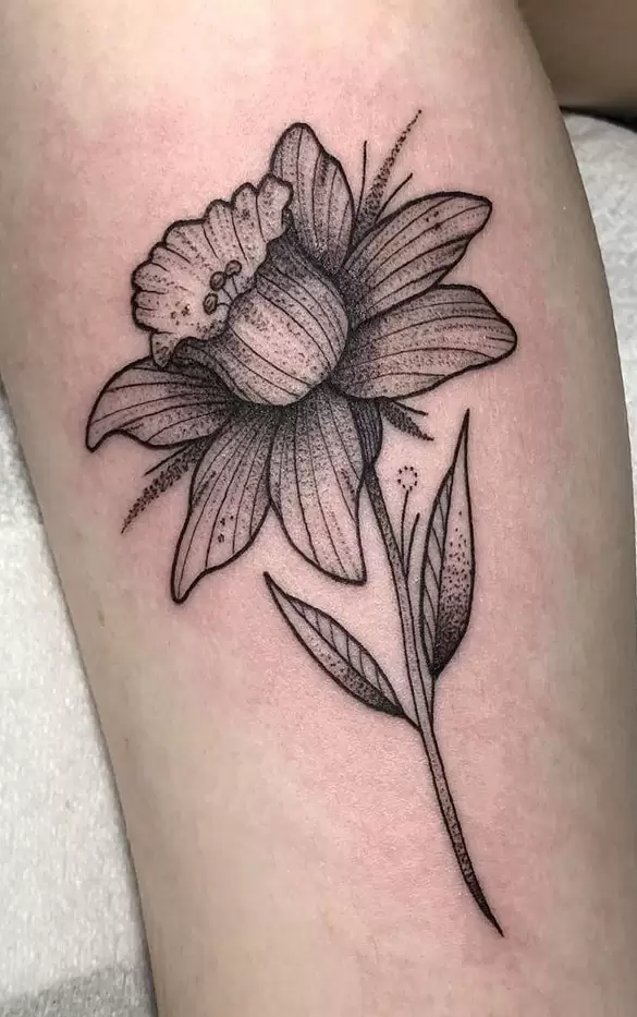 Large daffodil flower tattoo on the leg for men