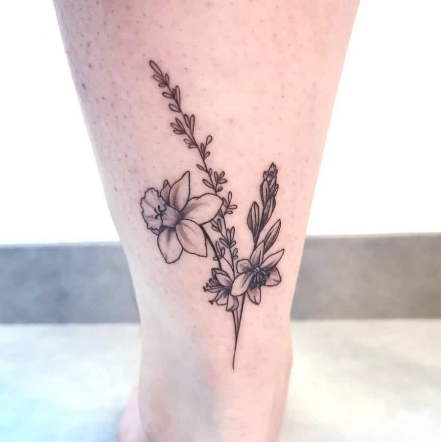 Daffodil flower tattoo on the calf for women