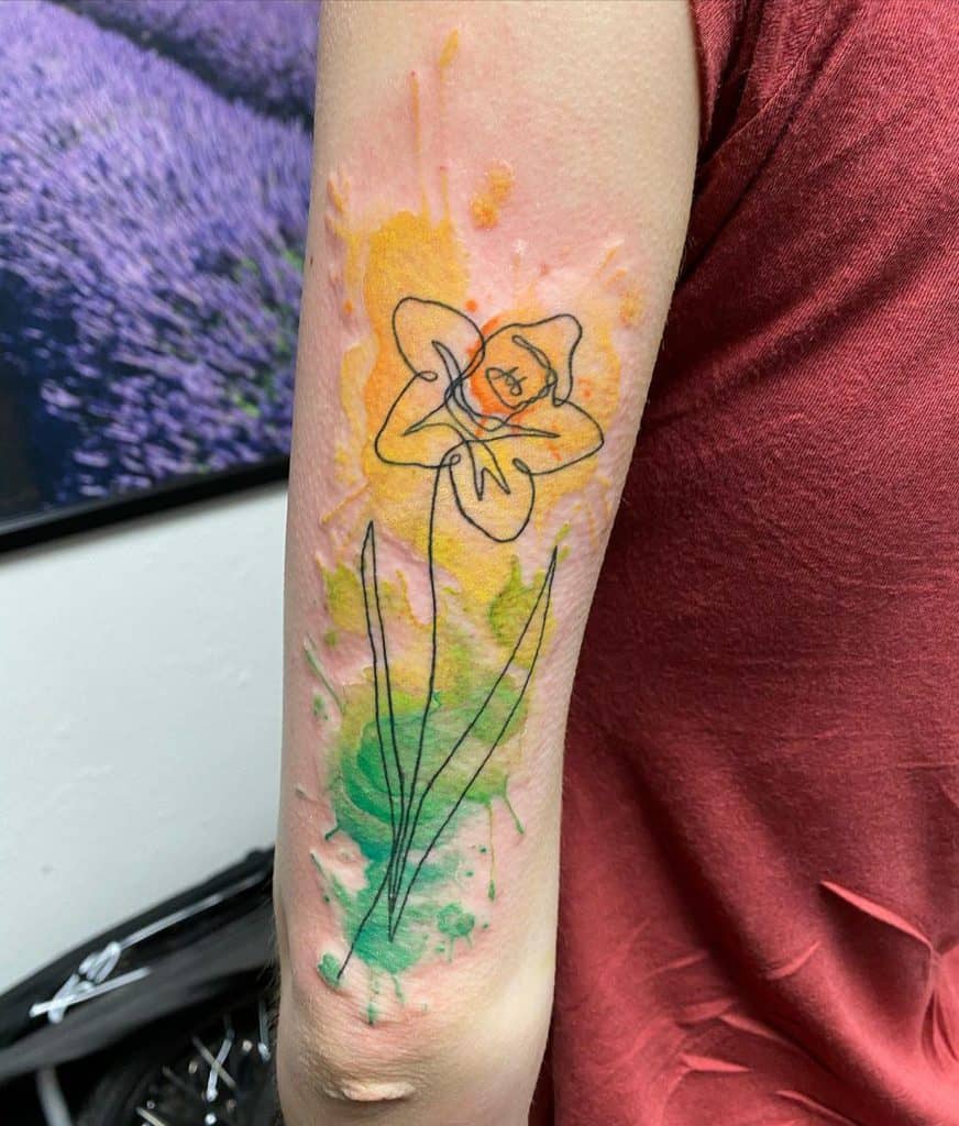 Daffodil flower tattoo on the shoulder for women