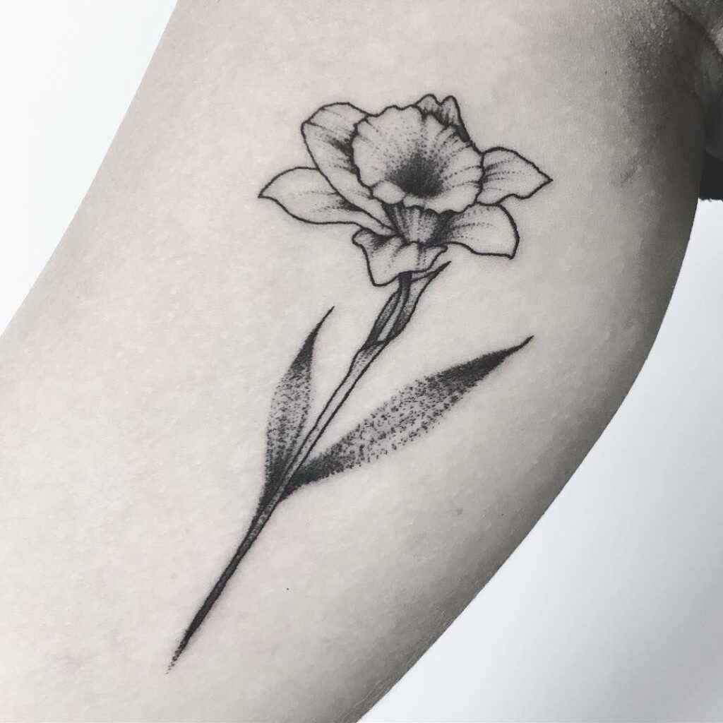 Large daffodil flower tattoo on the leg for women