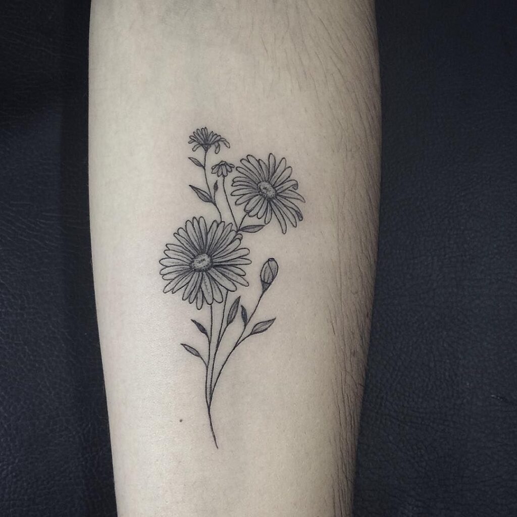 Daisy tattoo on forearm for men