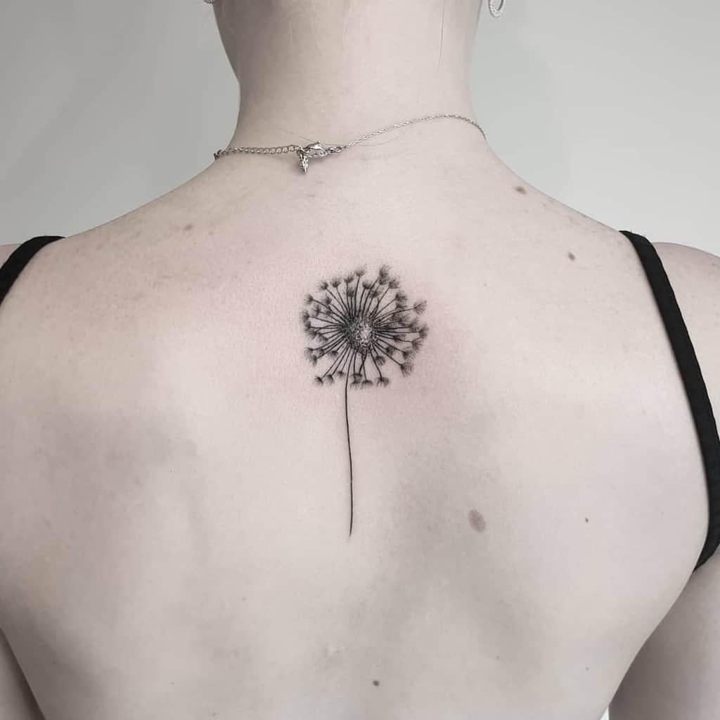 Dandelion tattoo on the back for women