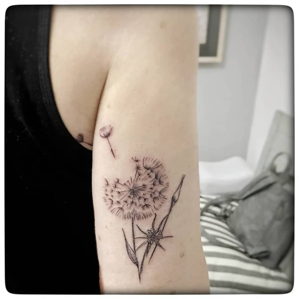 Large dandelion tattoo on the shoulder for women