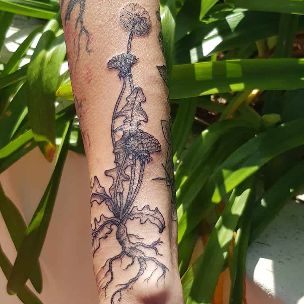 Large dandelion tattoo on the arm for women