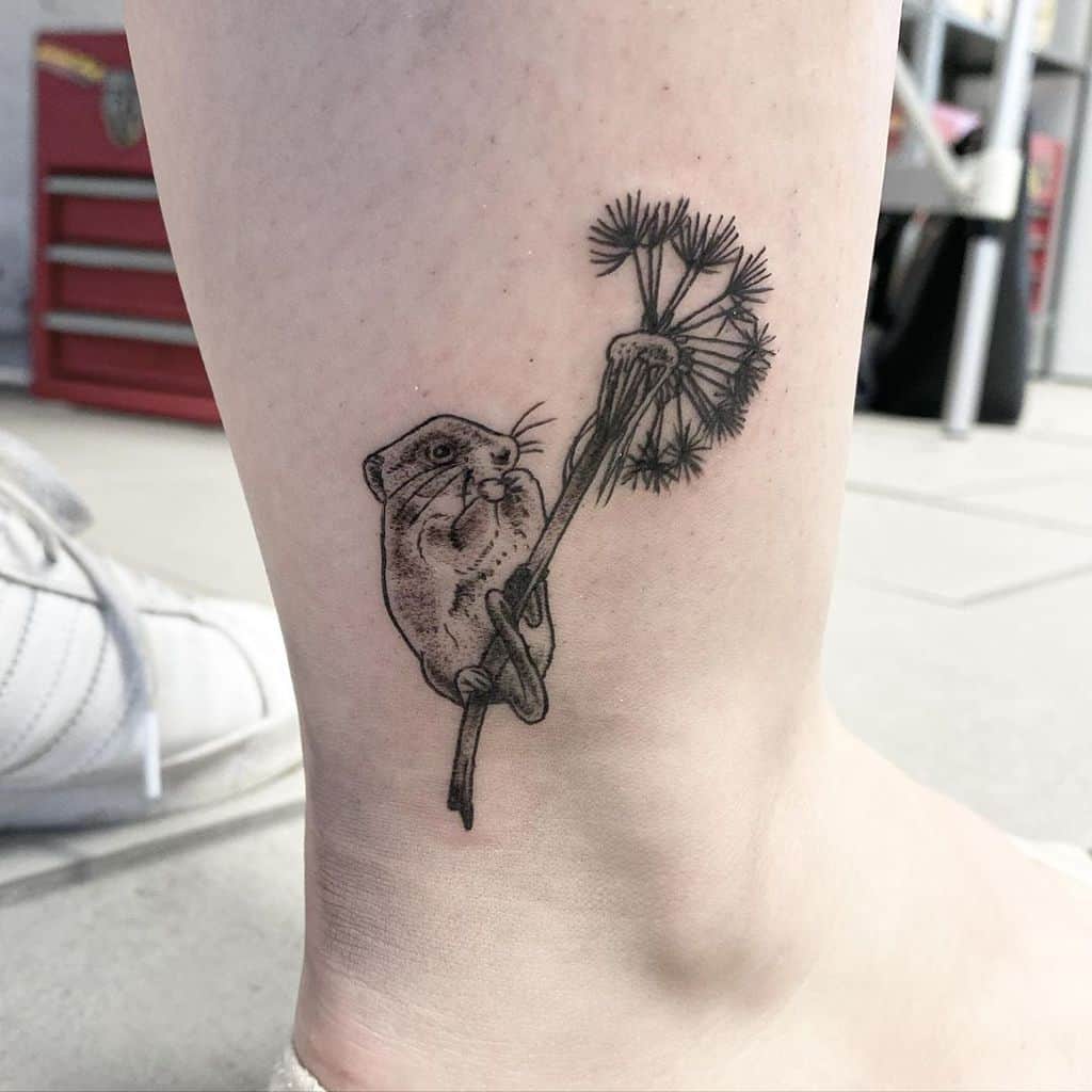 Dandelion tattoo with hamster on shin for women