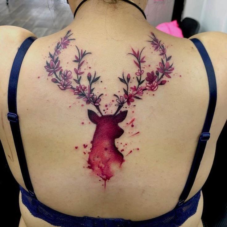 Colorful deer tattoo on the back for women