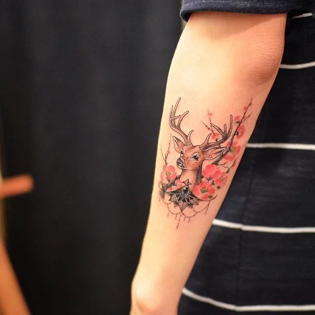 Color deer tattoo on forearm for men