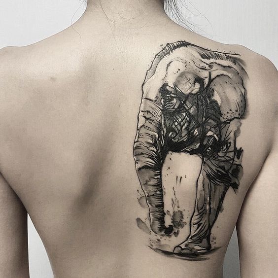 Elephant tattoo on the shoulder blade for women