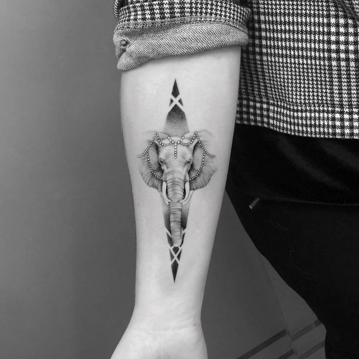 Elephant tattoo on the forearm for women