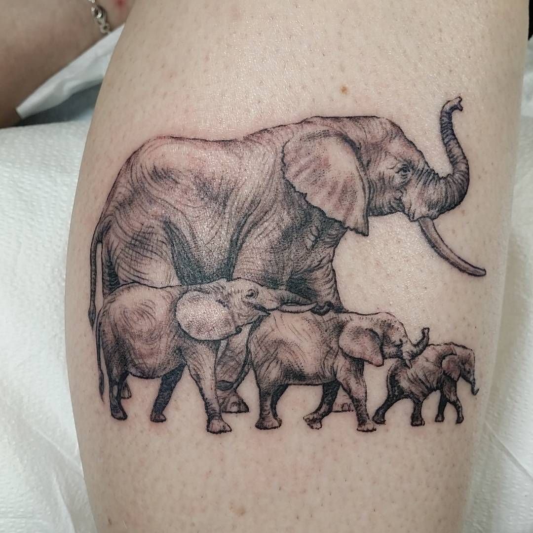 Four elephants tattooed on the leg for women