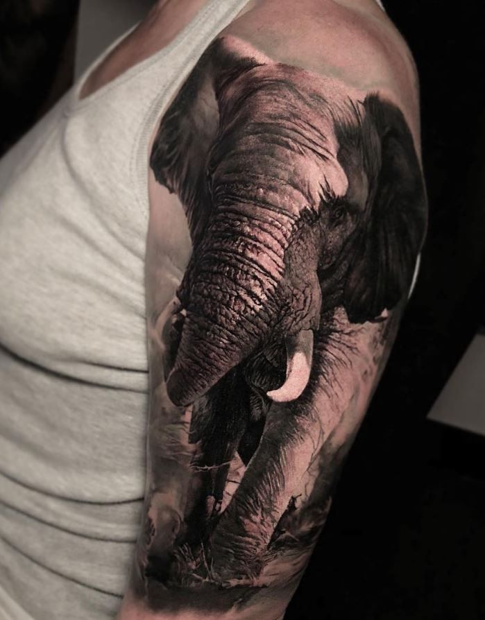 Large elephant tattoo on the shoulder for men