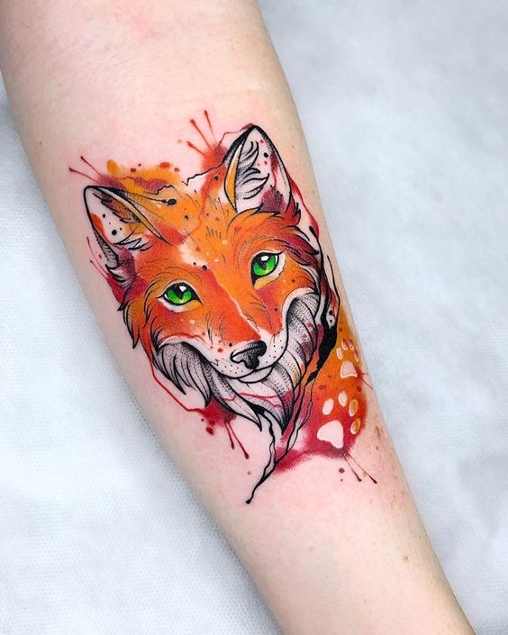 Tattoo of a colored fox on the forearm for women