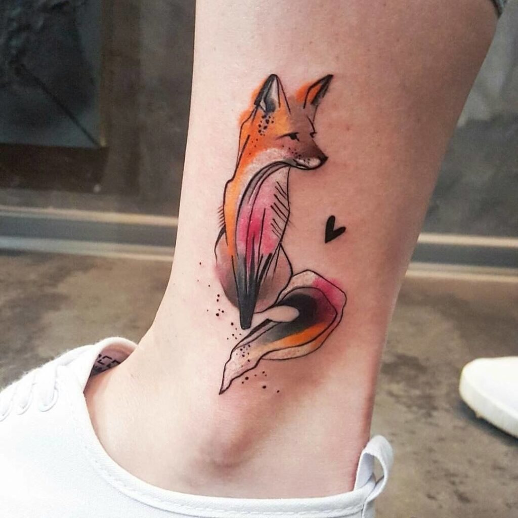 Tattoo of a colored fox on the shin for women