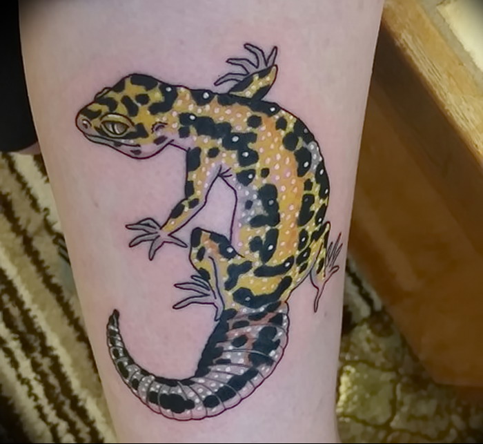 Salamander tattoo on the shin for women