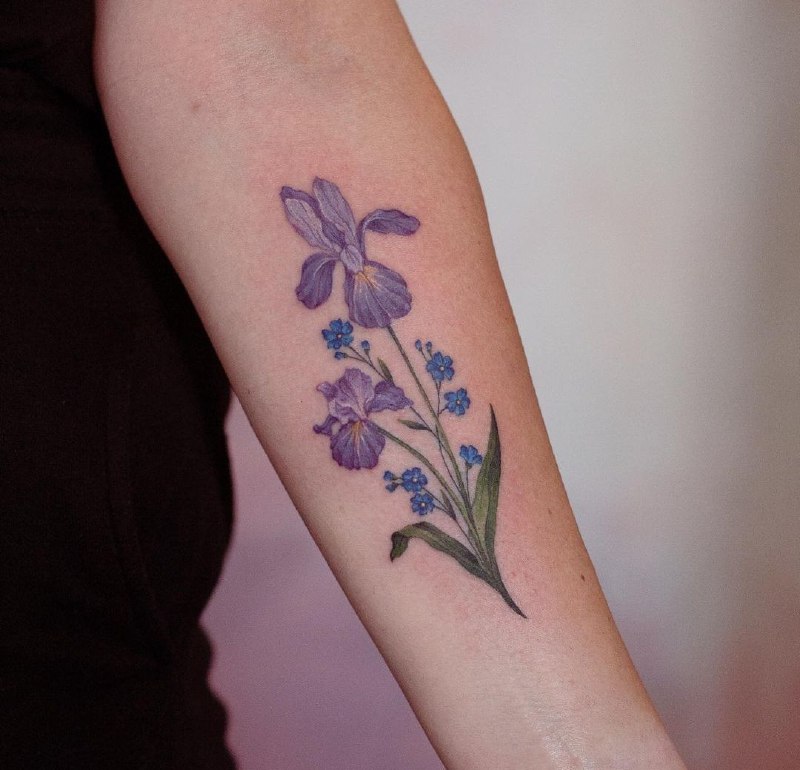 Color iris tattoo on the forearm for women