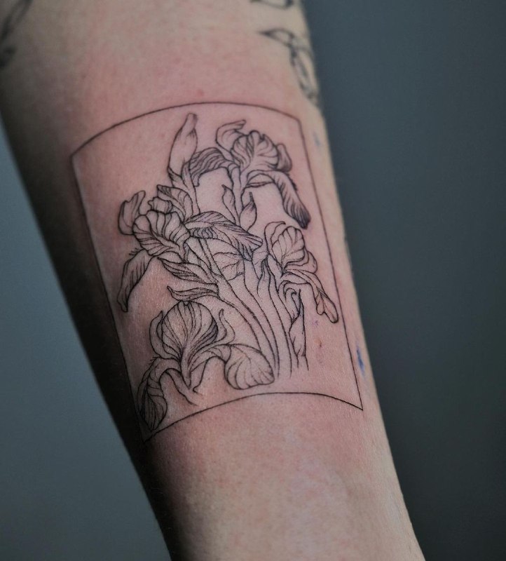 Iris tattoo on the forearm for men