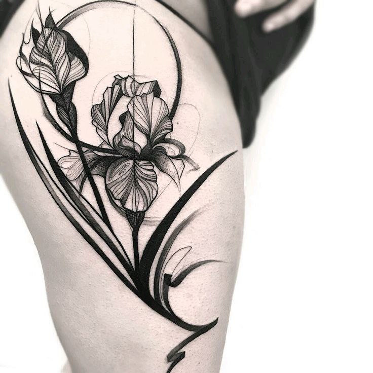 Iris tattoo on the thigh for women