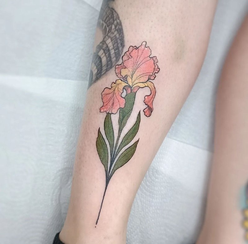 Color iris tattoo on the shin for women