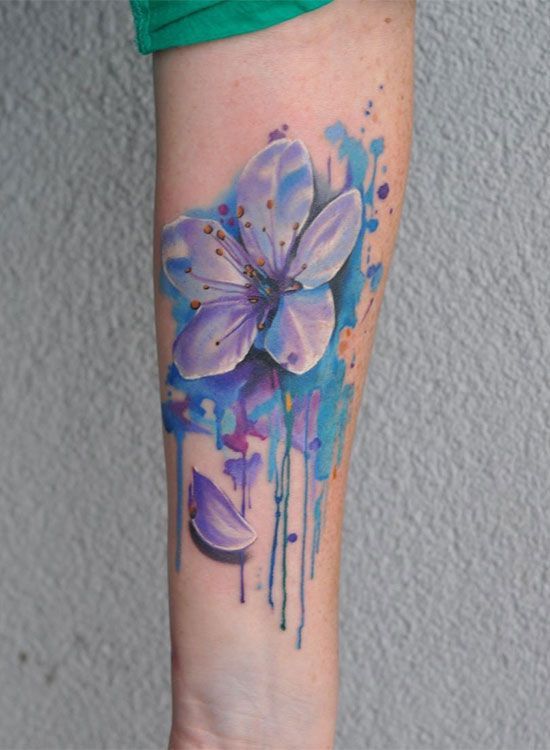 Colorful jasmine tattoo on the forearm for women