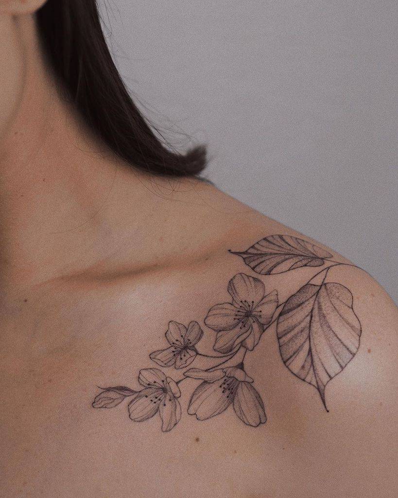 Jasmine tattoo on the collarbone for women