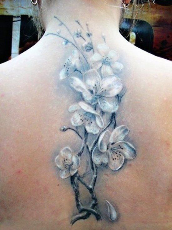 Jasmine tattoo on the spine for women