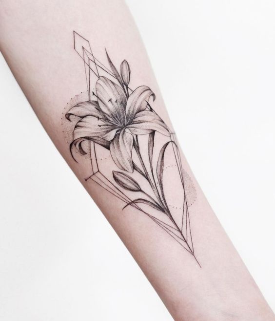 Large lily tattoo on forearm for women