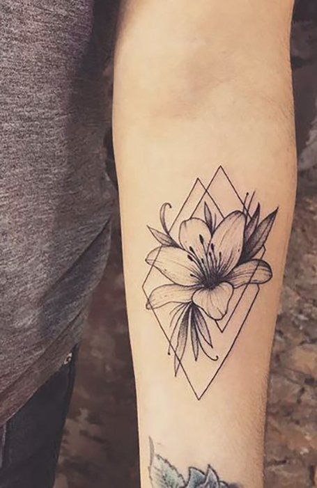 Lily tattoo on forearm for women