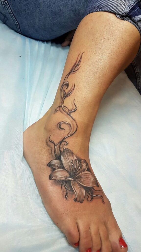 Tattoo of lilies on the ankle for women