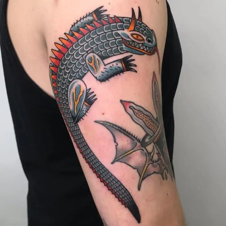 Tattoo of a colored lizard on the shoulder for men