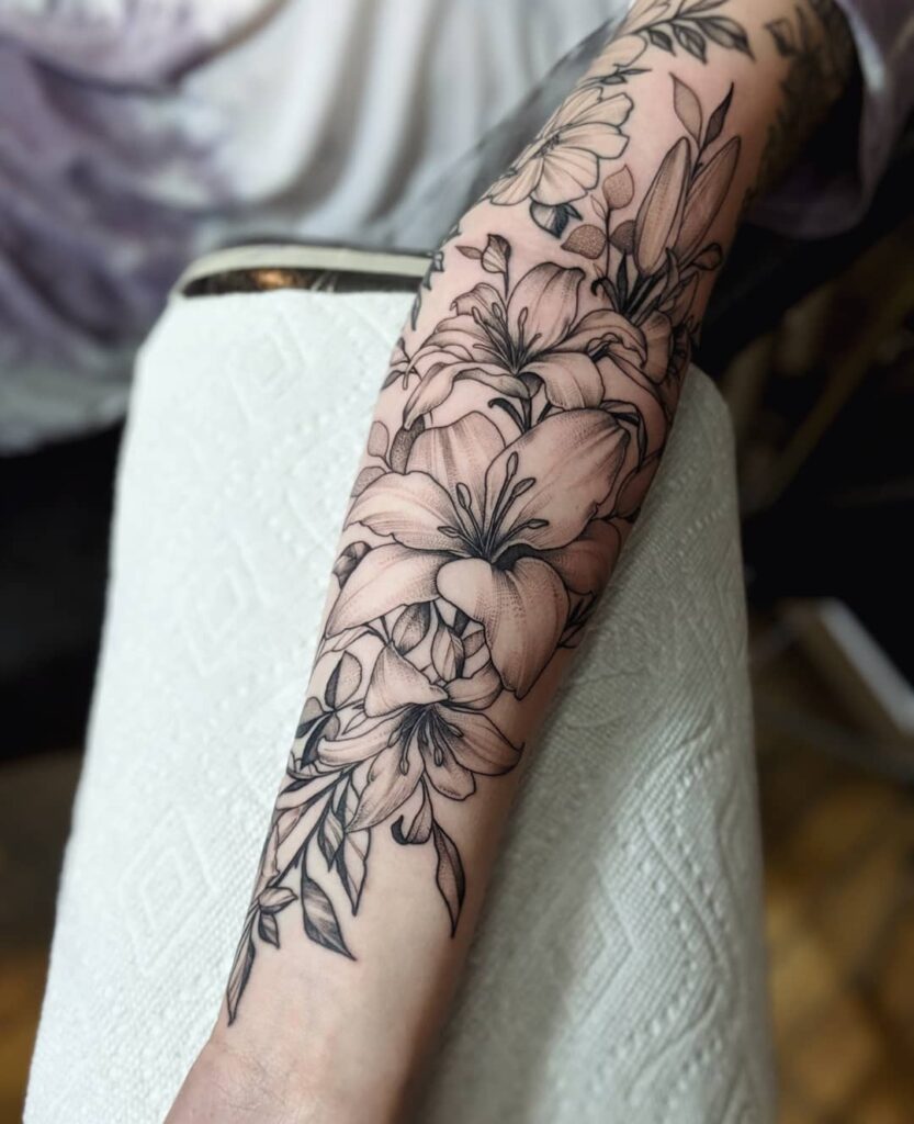 Lotus tattoo on the arm for women