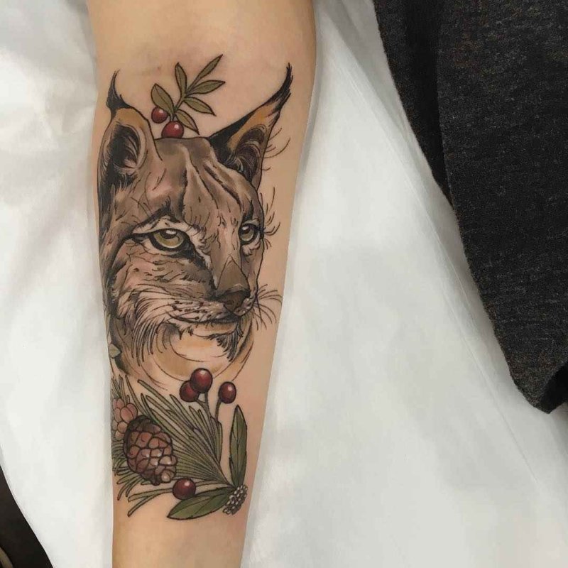 Lynx tattoo on the forearm for women