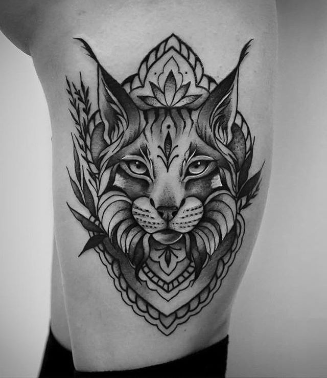 Tattoo of a lynx on the shin for women