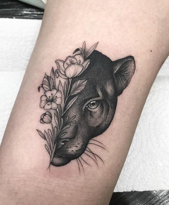 Panther tattoo on the forearm for women