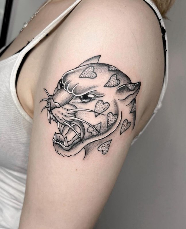 Tattoo of a panther on the shoulder for women