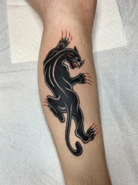 Panther tattoo on the shin for men