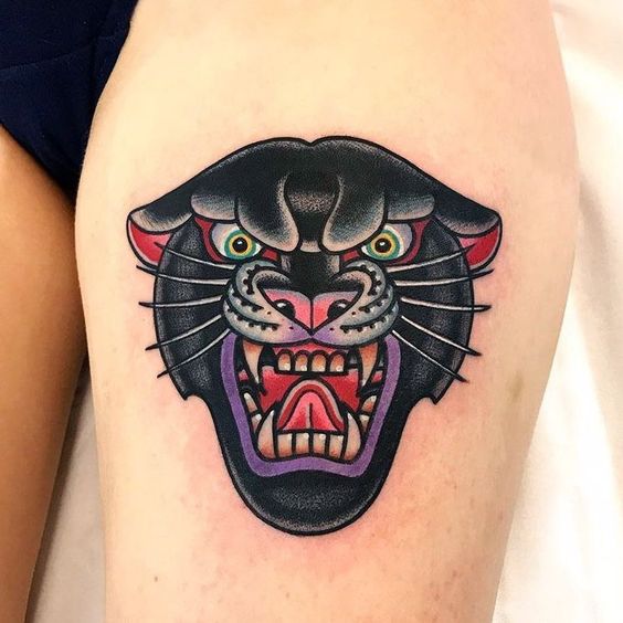 Colored panther tattoo on the thigh for women