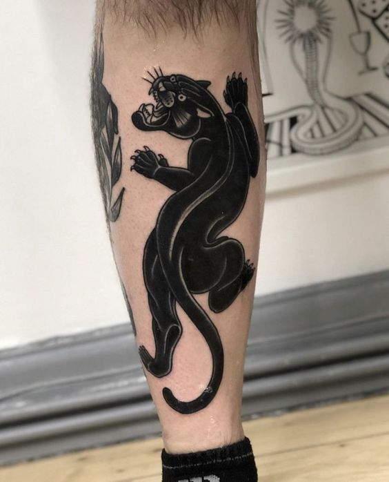 Panther tattoo on the shin for men