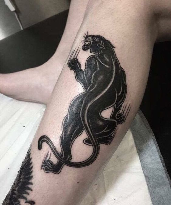 Panther tattoo on the shin for men