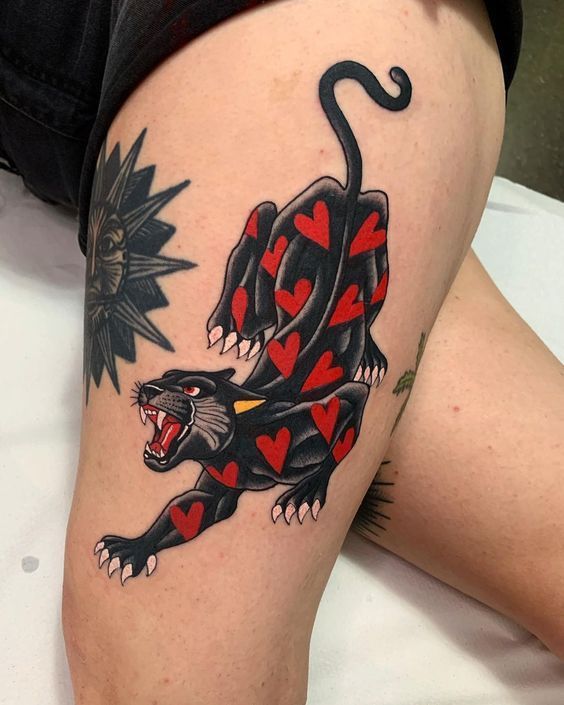 Panther tattoo on the thigh for women