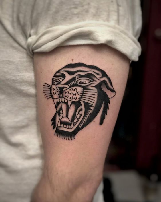 Tattoo of a panther on the shoulder for men