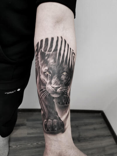 Panther tattoo on the forearm for men