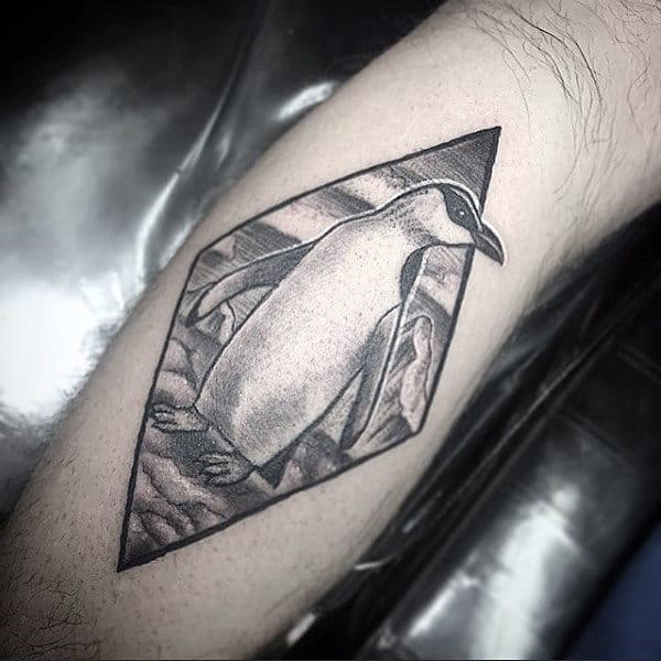 Penguin tattoo on the calf for men