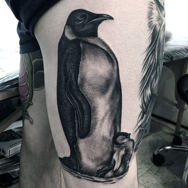 Penguin tattoo on the thigh for men