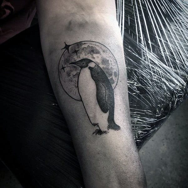 Tattoo of a penguin on the forearm for men