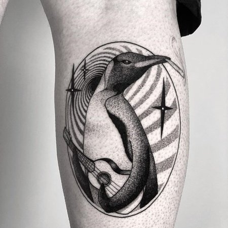 Tattoo of a penguin on the shin for men