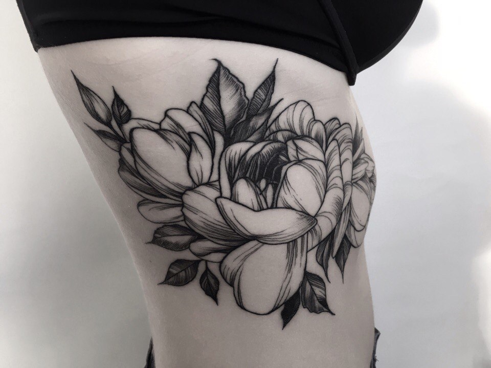 Large peony tattoo on the side for women