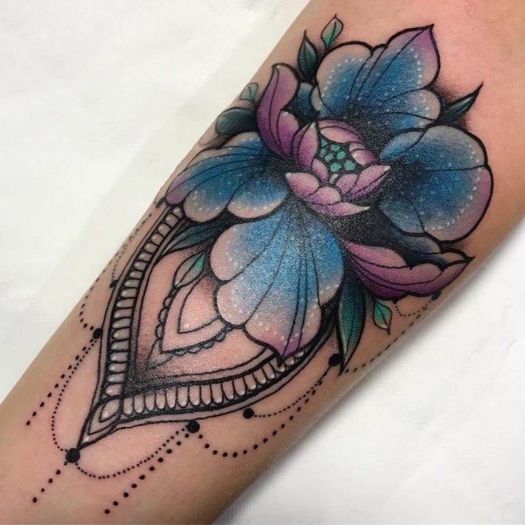 Colored peony tattoo on the arm for women